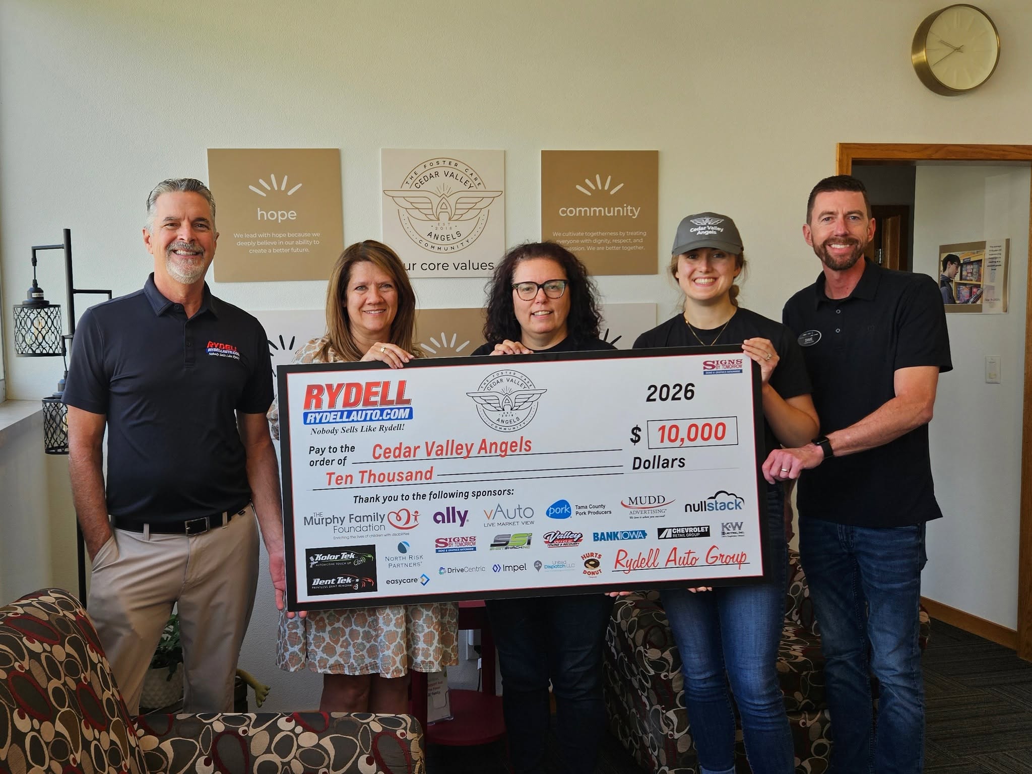 Rydell Auto presents a $10,000 check to Cedar Valley Angels from the 17th Annual Rydell Car & Bike Show Benefit in Waterloo IA