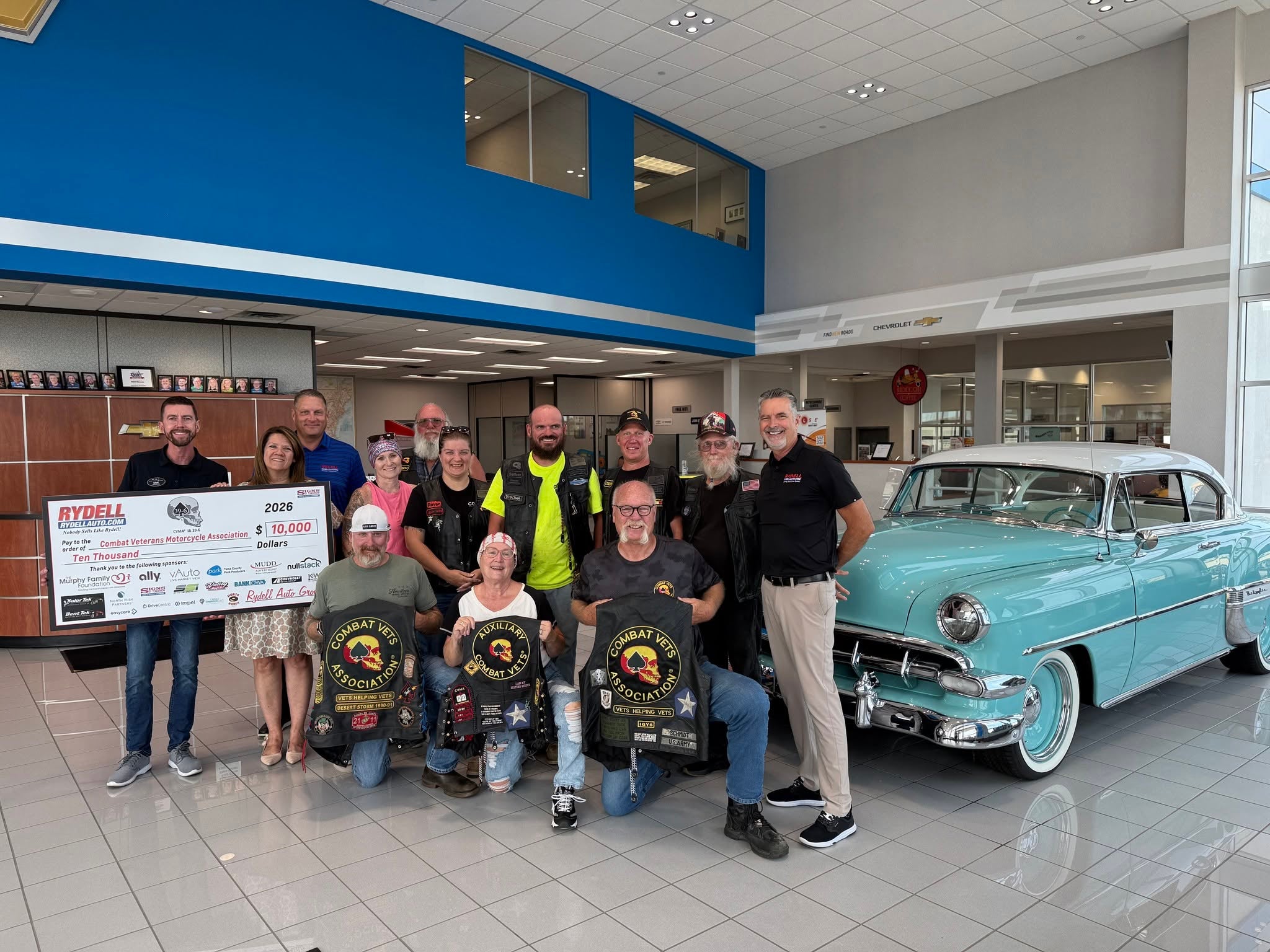 Rydell Auto presents a $10,000 check to Combat Veterans Motorcycle Association Chapter 39-6 from the 17th Annual Rydell Car & Bike Show Benefit in Waterloo IA